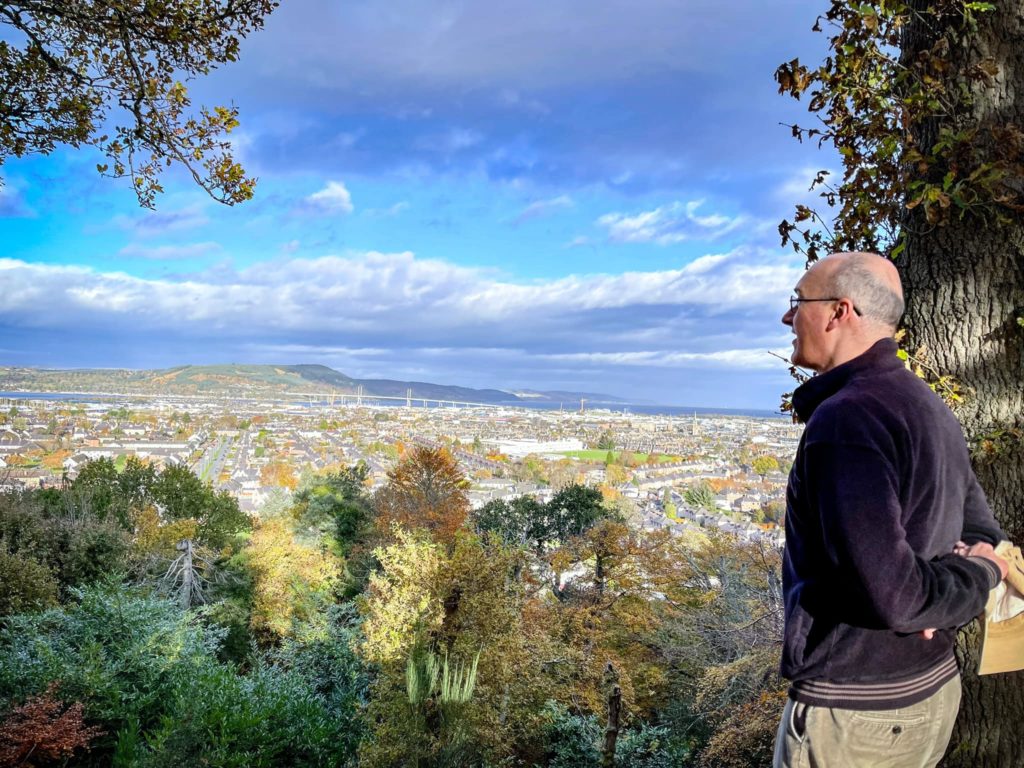 Man overlooking view in the Scottish Highlands